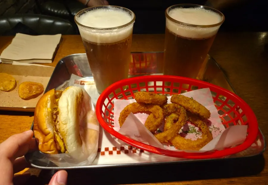 Double Bacon Cheeseburger, draft beer, and onion rings
