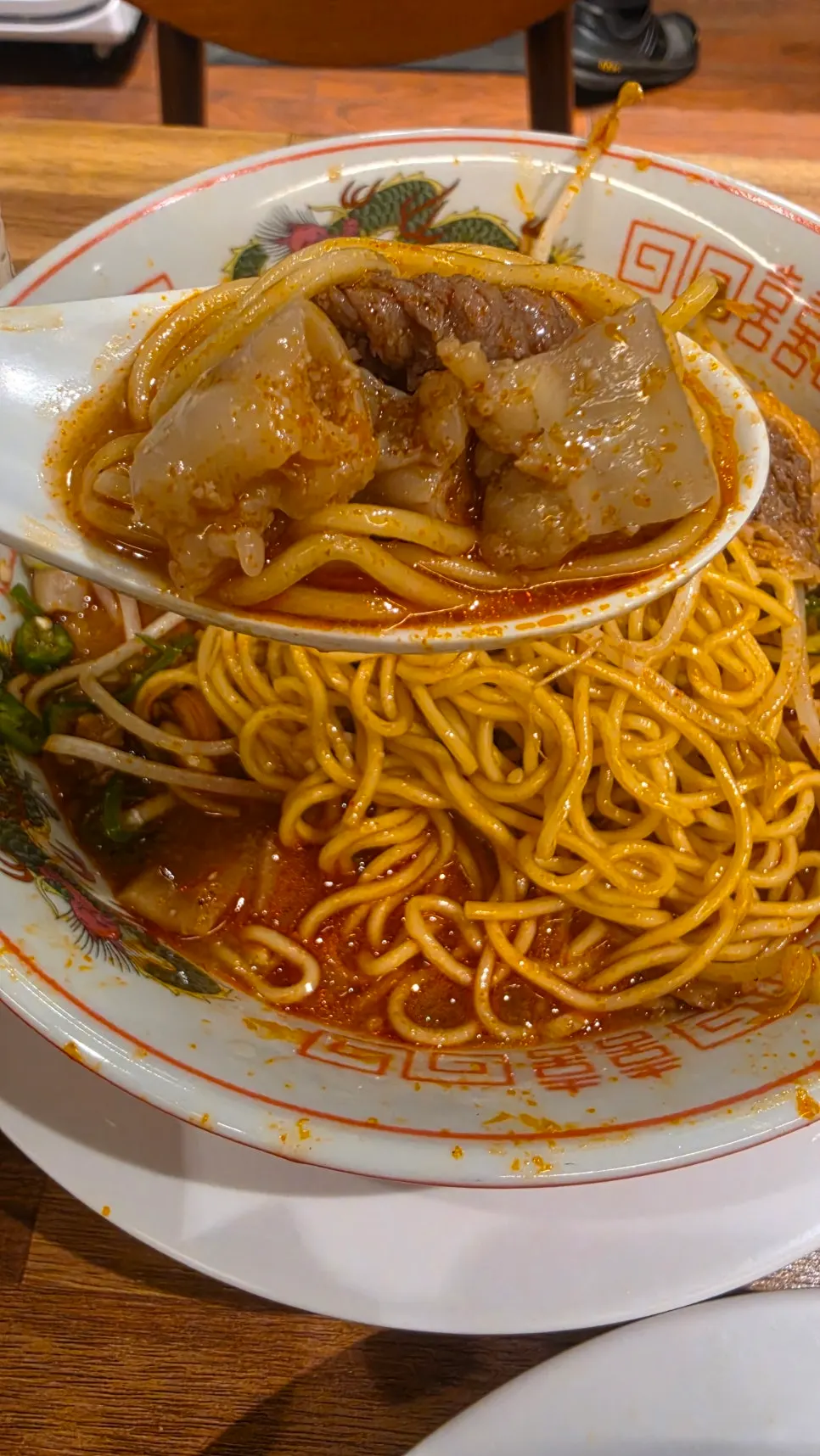 Motsu ramen topped with beef intestines and bean sprouts