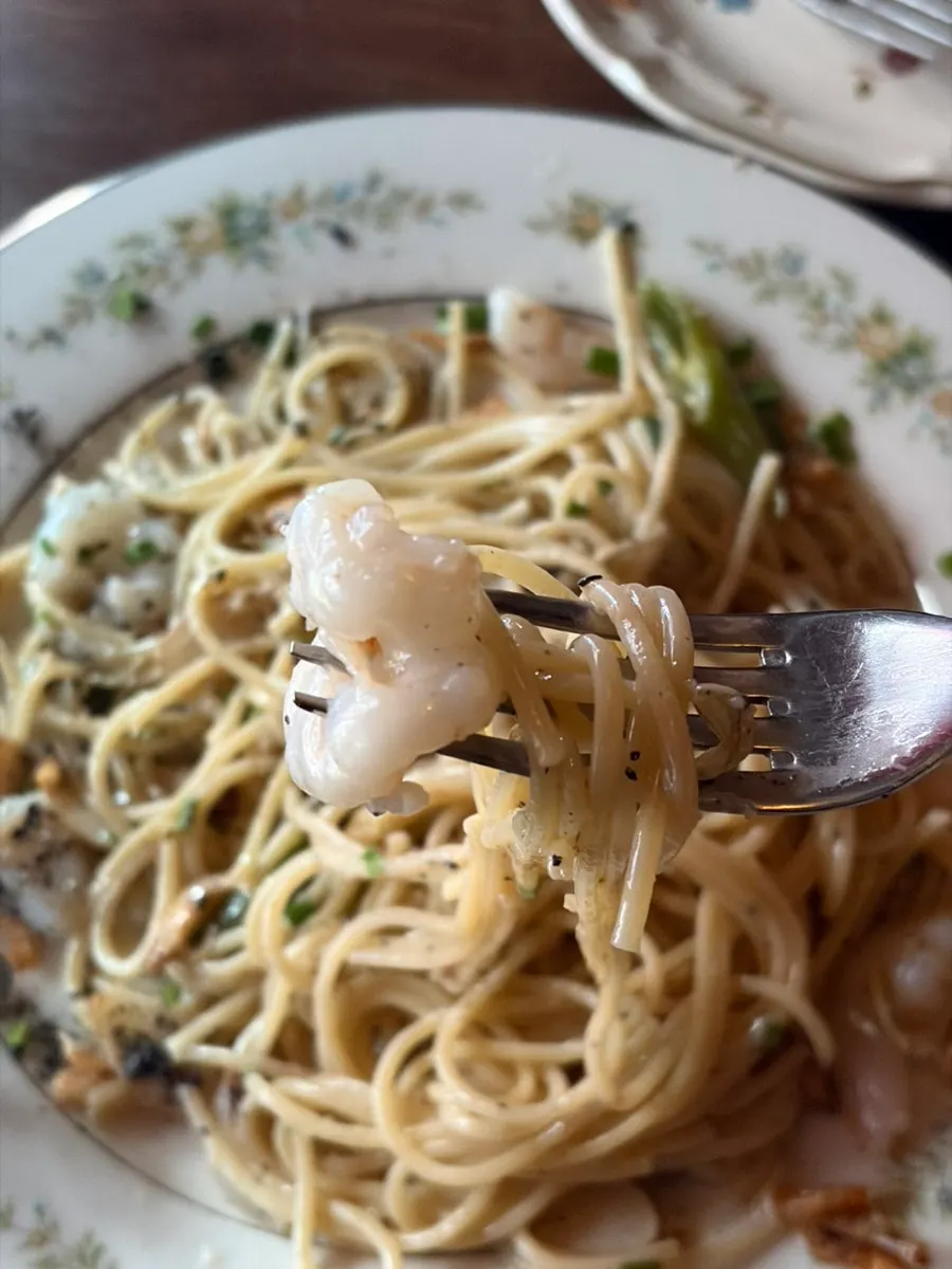 Seafood pasta enjoyed with wine