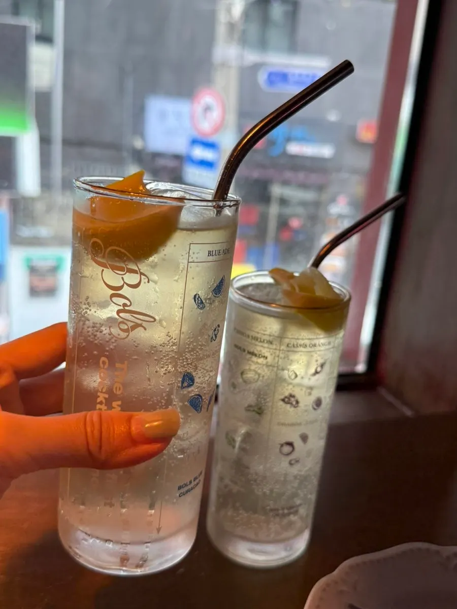 A highball glass full of ice at Hey Jinny