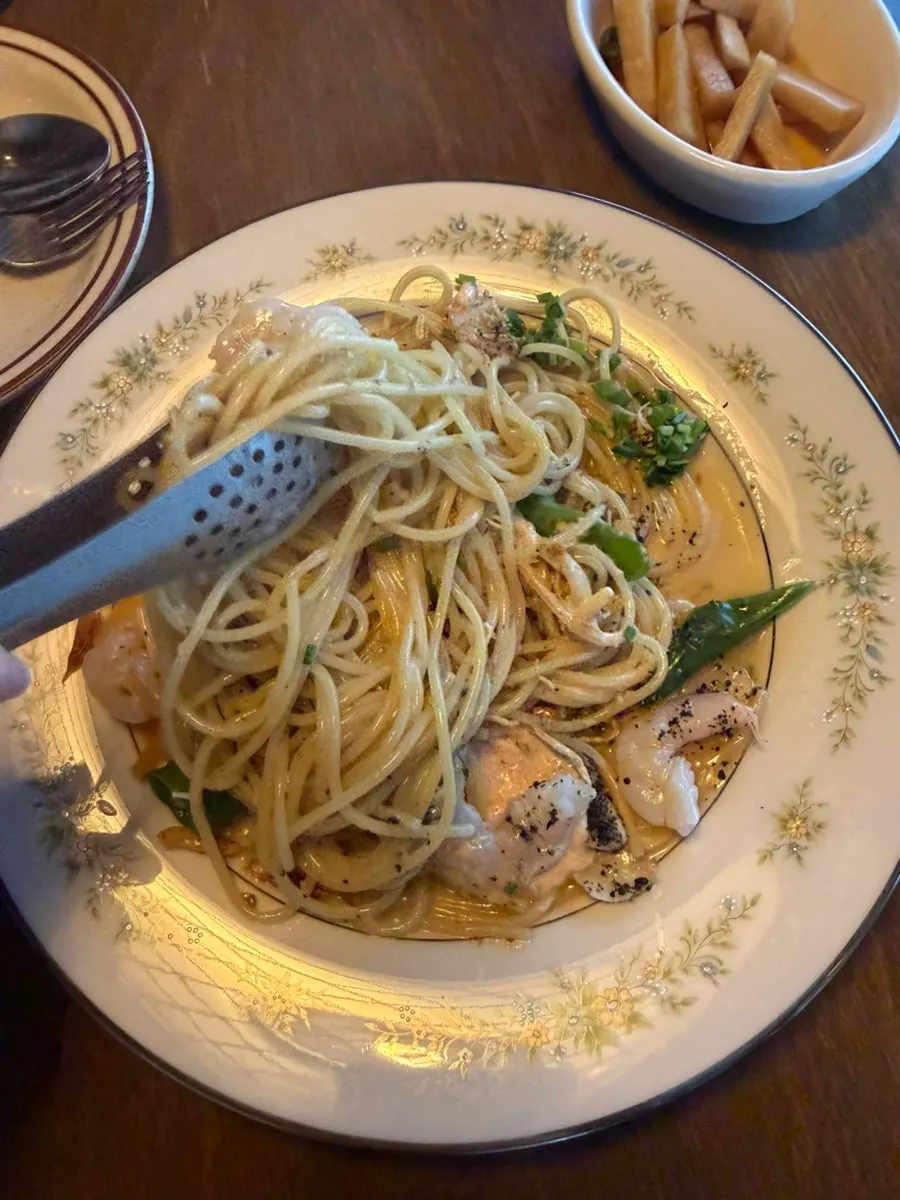 Oil pasta placed alongside a highball