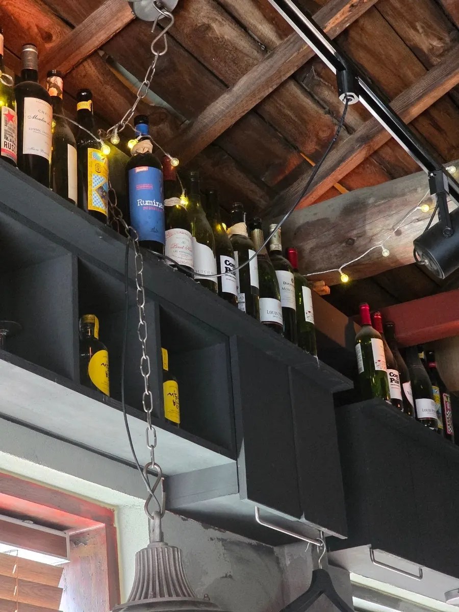 Interior of Hey Jinny decorated with soft lighting, posters, and small decor pieces
