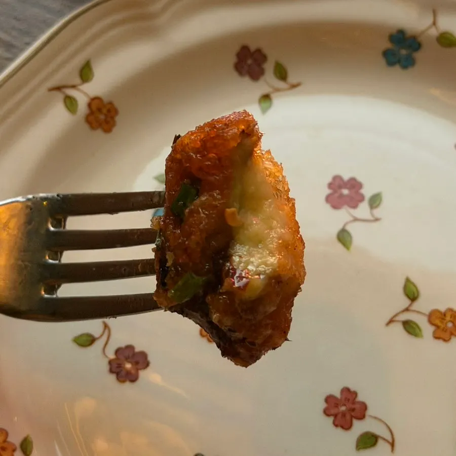 Close-up of fried eggplant coated in fish-fragrant sauce