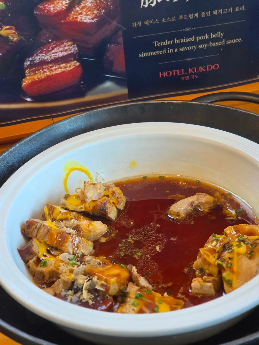 Chicken and pork dishes prepared on the buffet