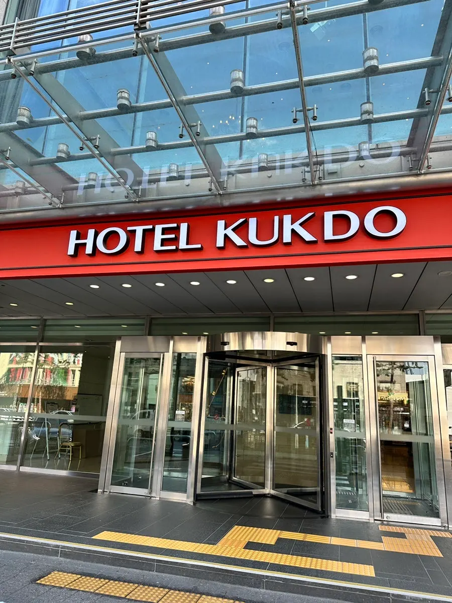 Asian buffet signage on the exterior wall of Hotel Kukdo in Euljiro