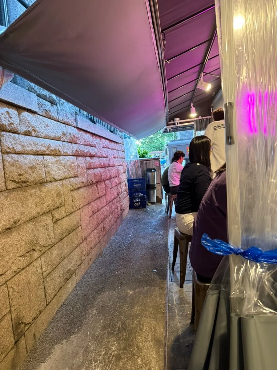 Seating at Hyeonseoni-ne Cheonggye Instant Branch with street-tent vibes