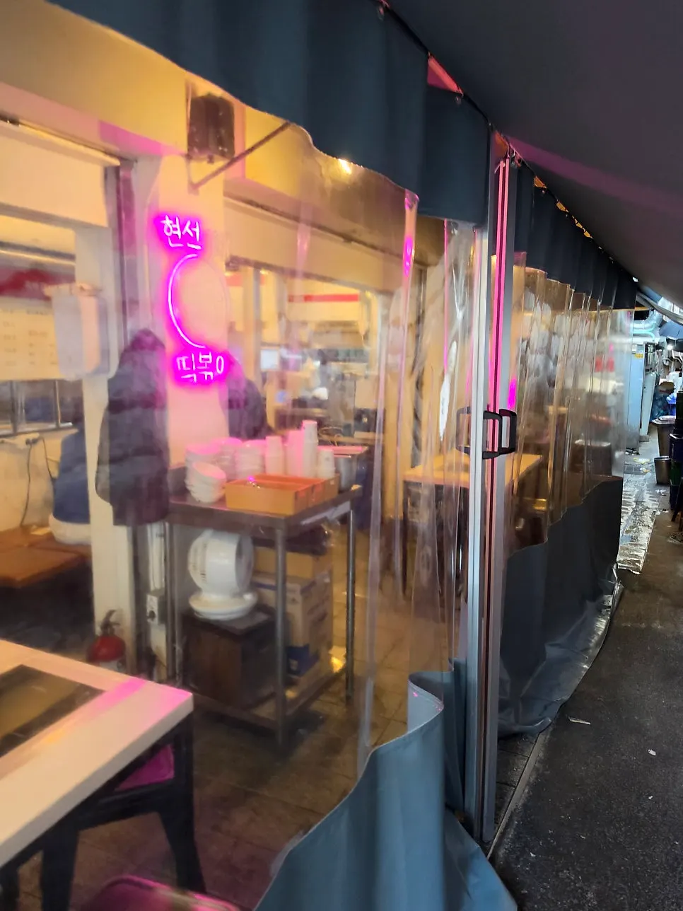 Shop exterior enclosed by plastic curtains