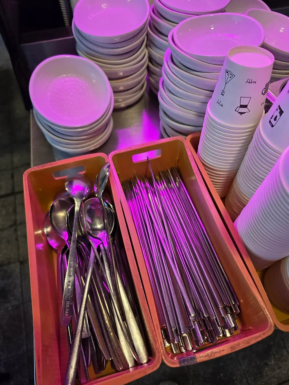 Neatly arranged self-service tableware corner