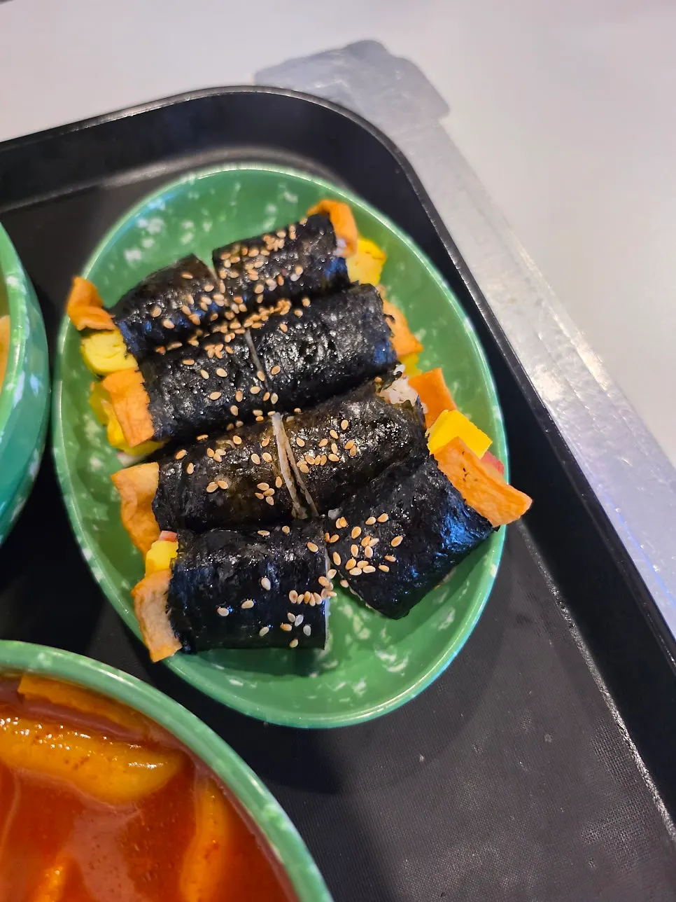 Bite-sized mini gimbap sprinkled with sesame seeds
