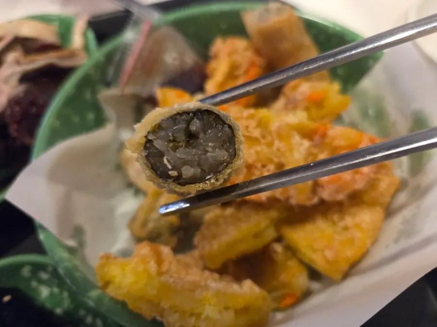 Assorted fried snacks cut into bite-sized pieces