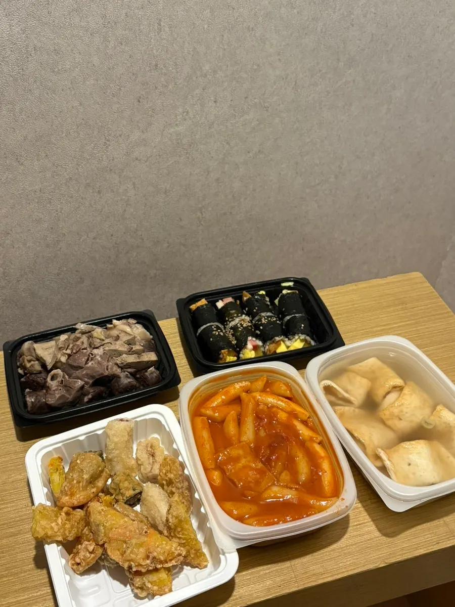 Tteokbokki in a takeout container