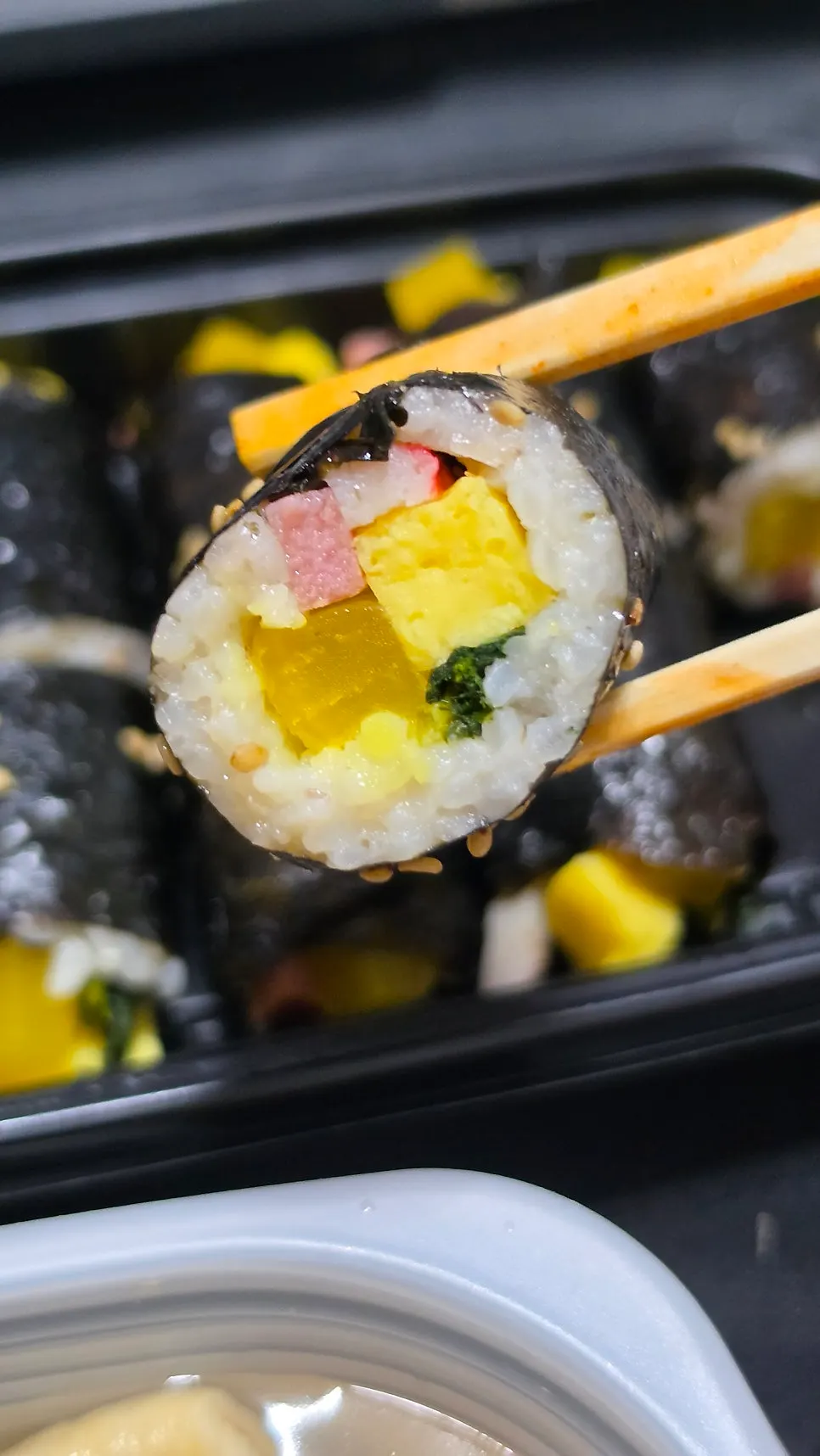 Mini gimbap enjoyed with a beer-and-soju mix