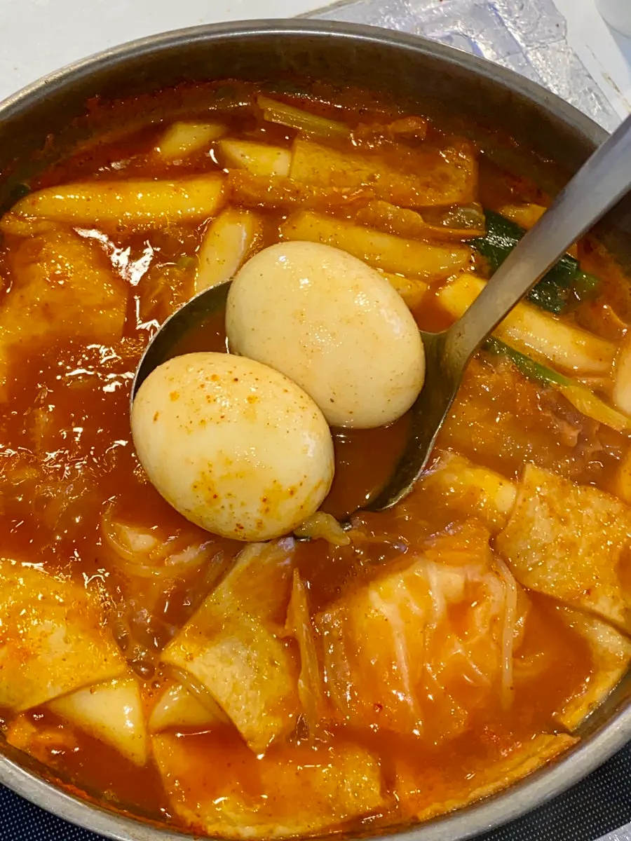 The instant tteokbokki near the end, egg still left in the pot