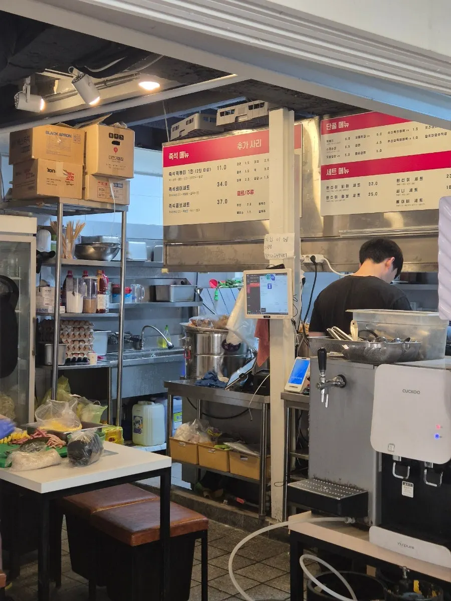 Menu listing tteokbokki, sundae, and fritters