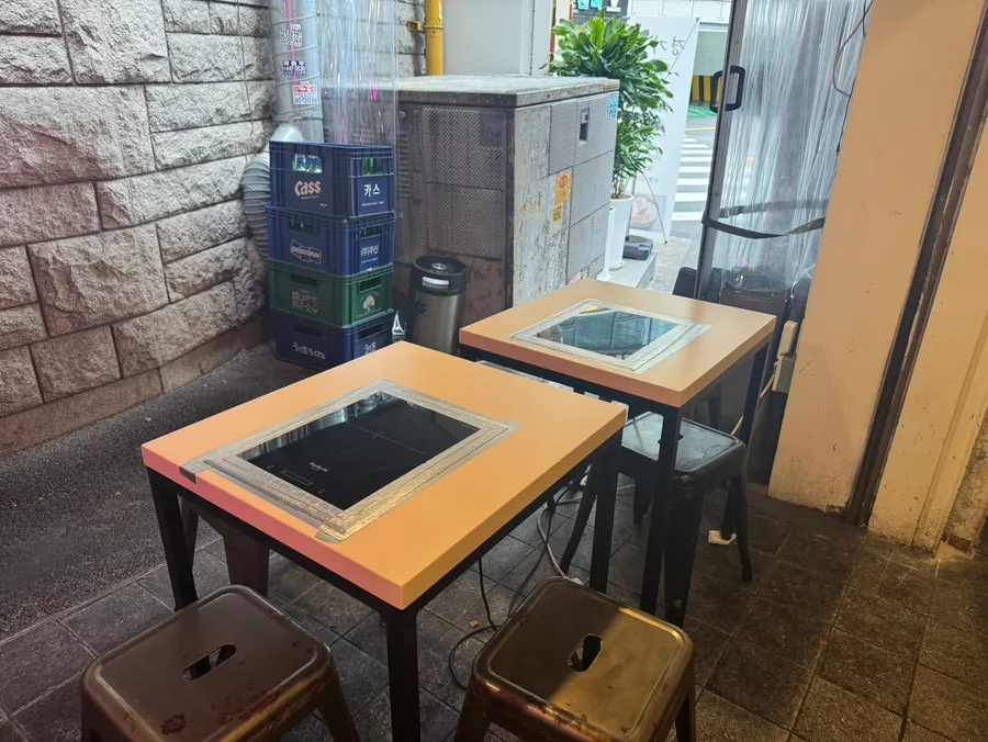 Old-school-style tables running from the entrance to the back