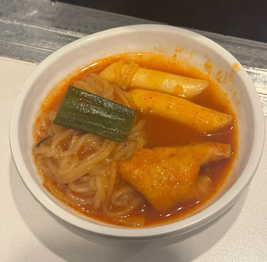 Instant tteokbokki bubbling on the tabletop induction burner