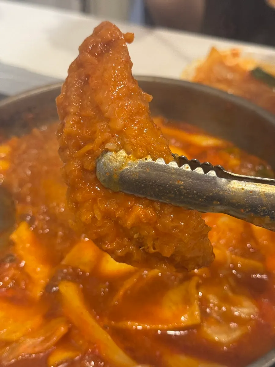 Fried mandu dipped in the tteokbokki broth