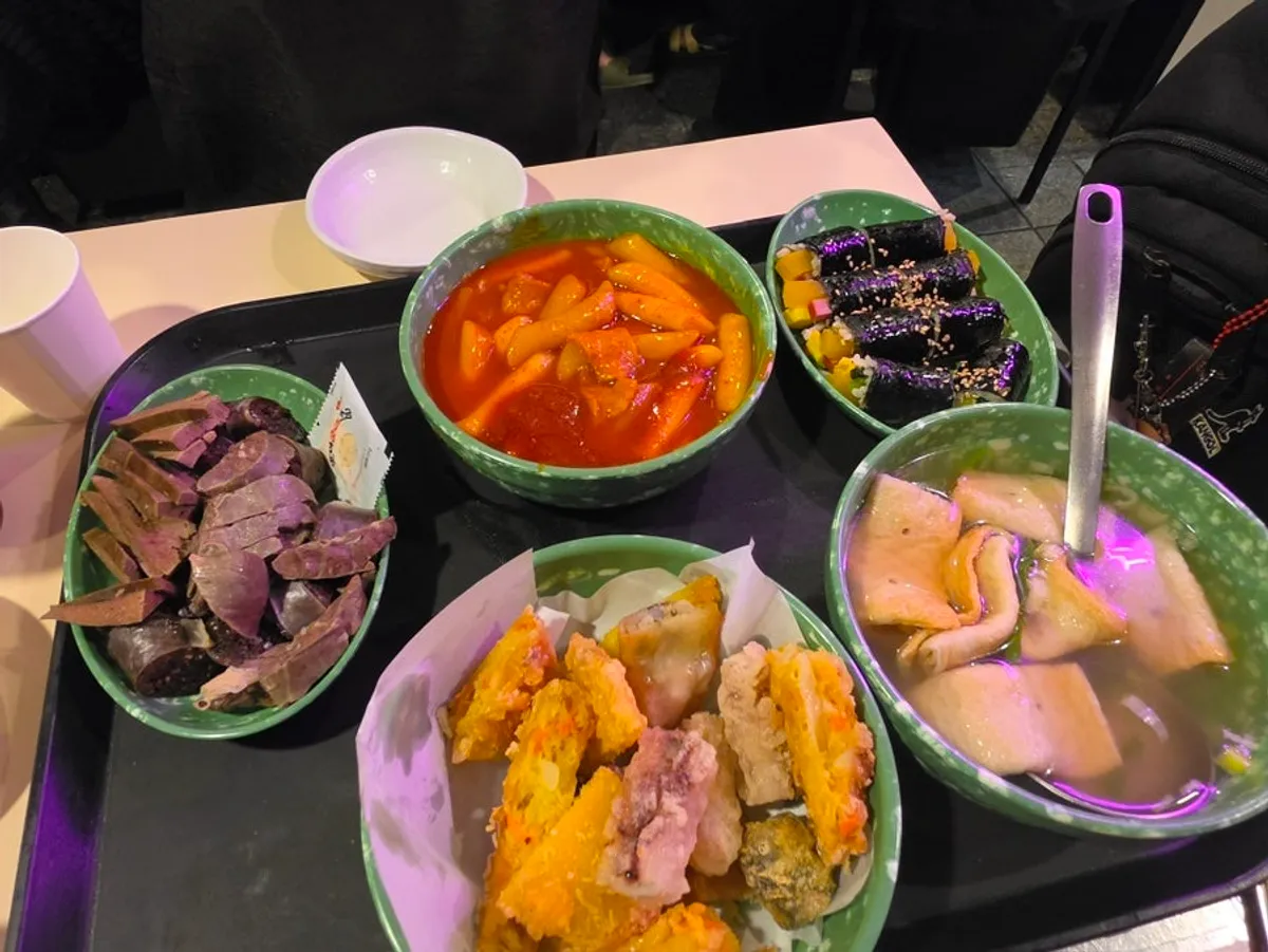 The Hyeonseoni Combo spread with tteokbokki, sundae, fried snacks, gimbap, and fish cake