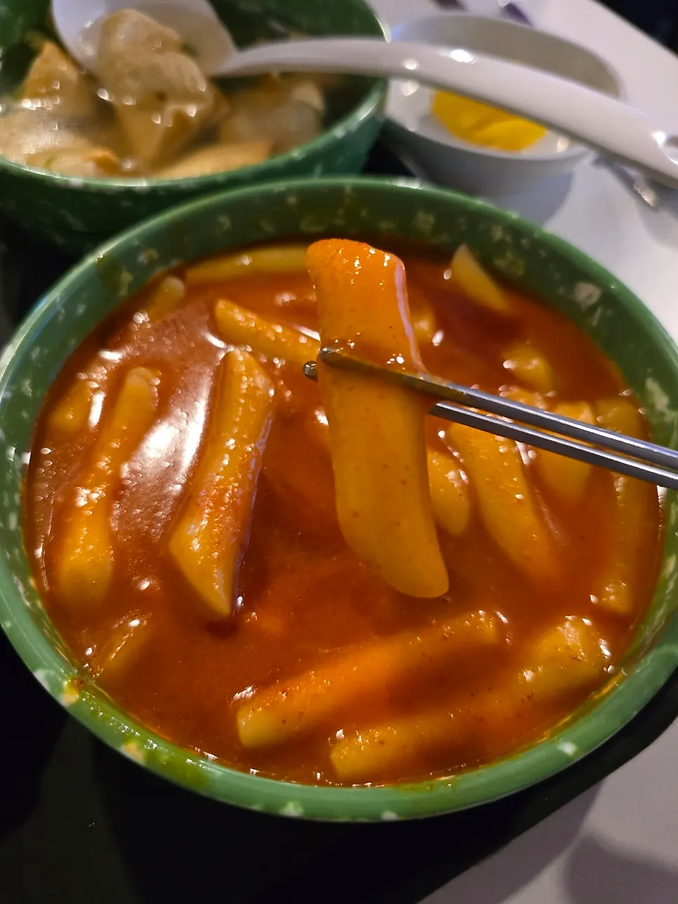 Ladling up fish cake soup broth