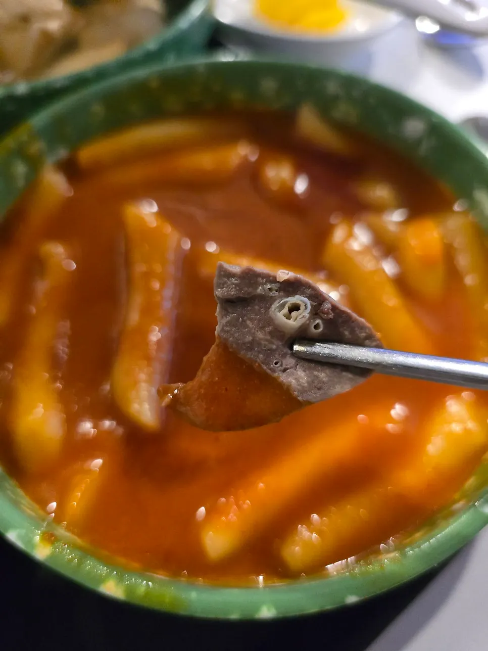 Squid fritter dipped in tteokbokki broth