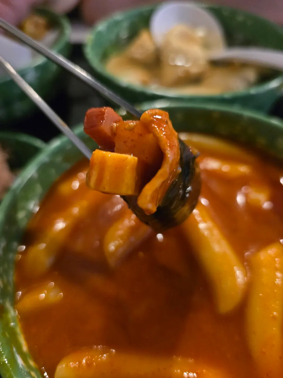 Piece of lung dipped in tteokbokki broth