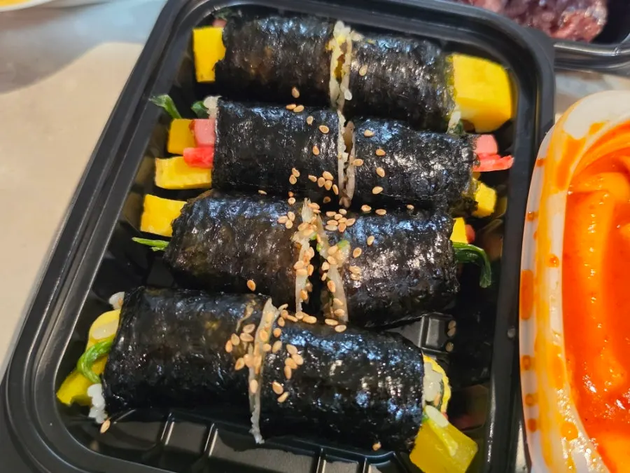 Assorted fried snacks with squid and mini gimbap rolls