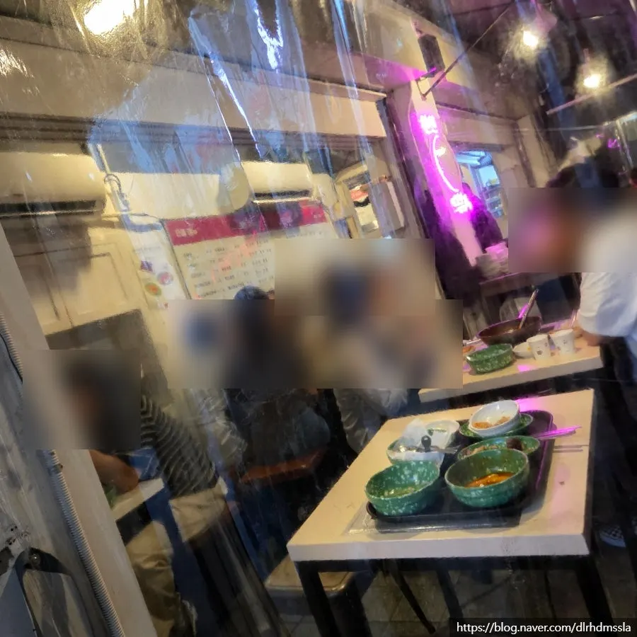 Narrow alley entrance packed with customers