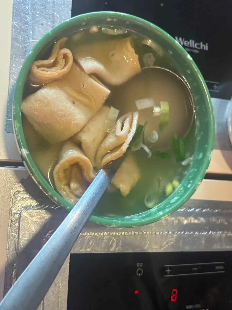 Gimbap dipped into the tteokbokki broth