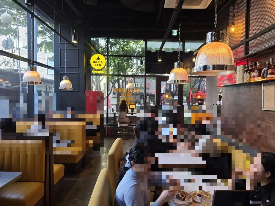 Diner interior with pendant lighting and plants