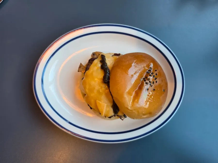 Burger with brioche bun brushed with truffle oil