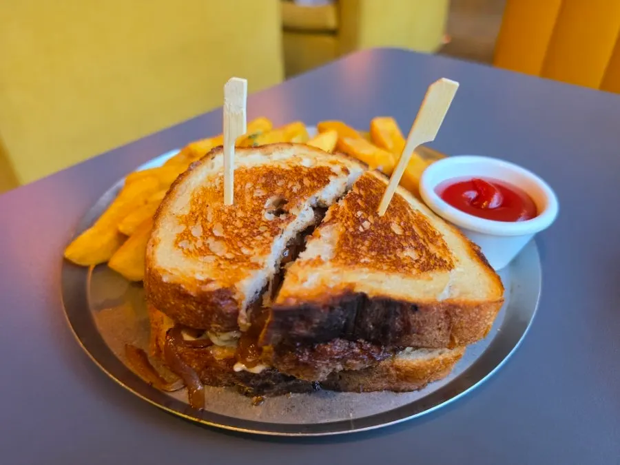 Patty melt with melted Swiss cheese