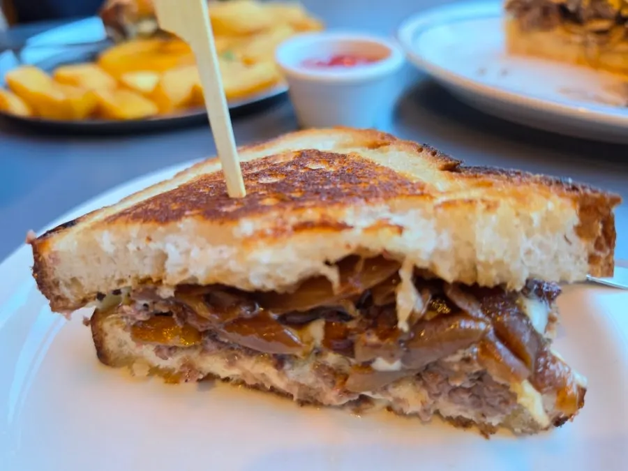 Cross-section of patty melt showing caramelized onions