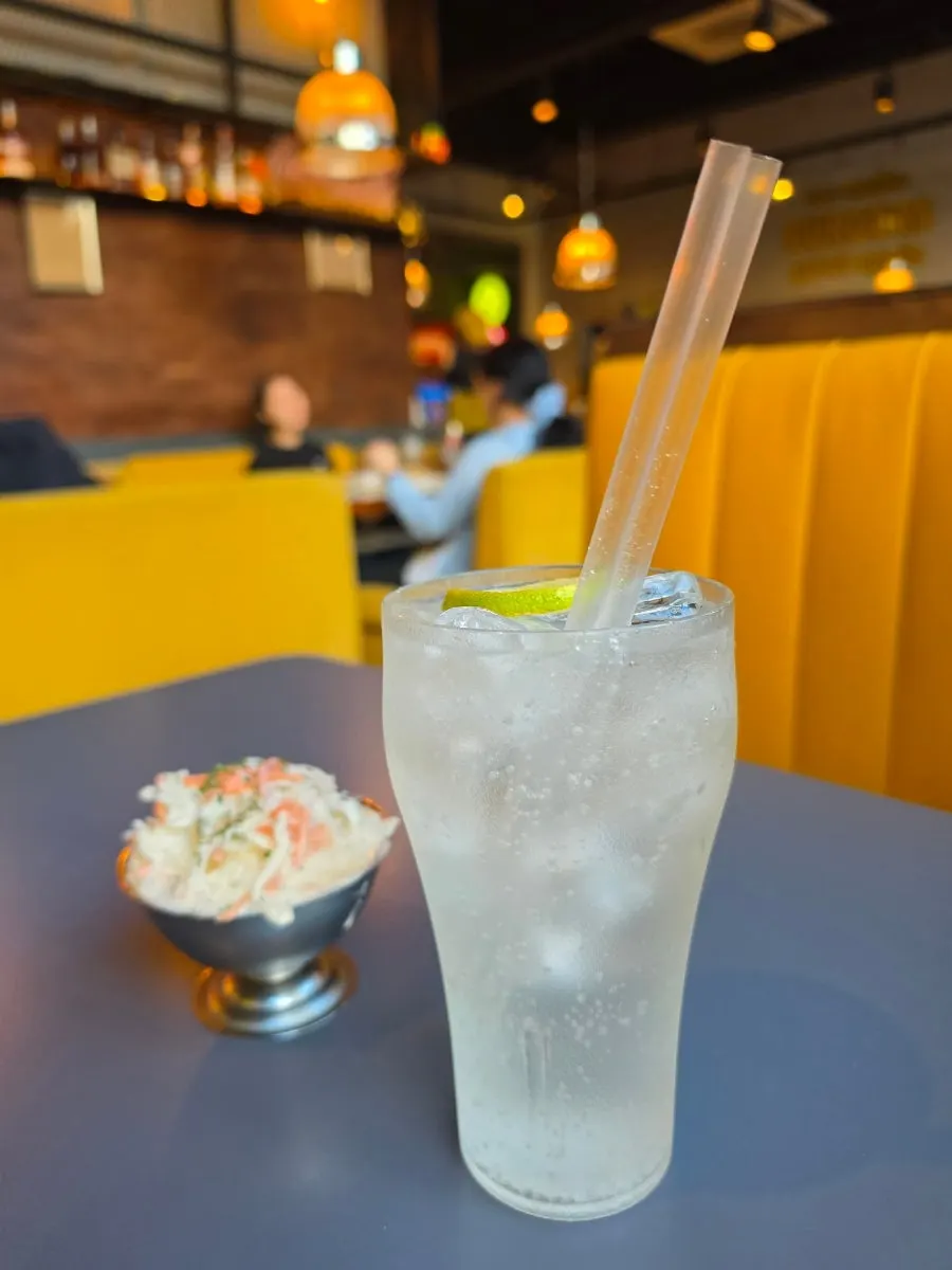 A glass of soda water topped with lime