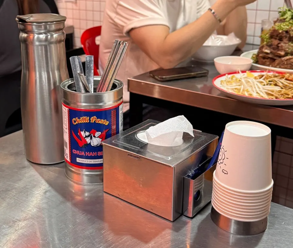 Water bottle and chopsticks set on the stainless steel table