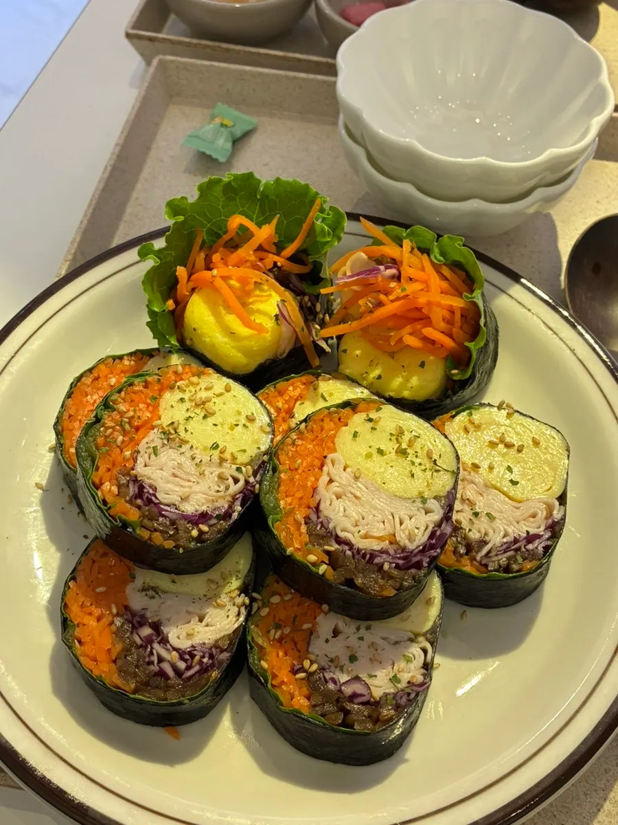 Cross-section of vegetable-packed keto chicken breast gimbap