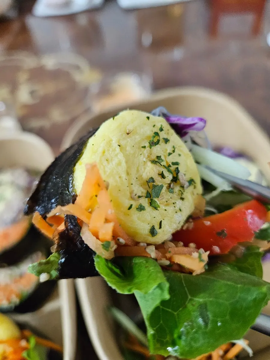 Keto vegetable gimbap tail piece with vegetables poking out