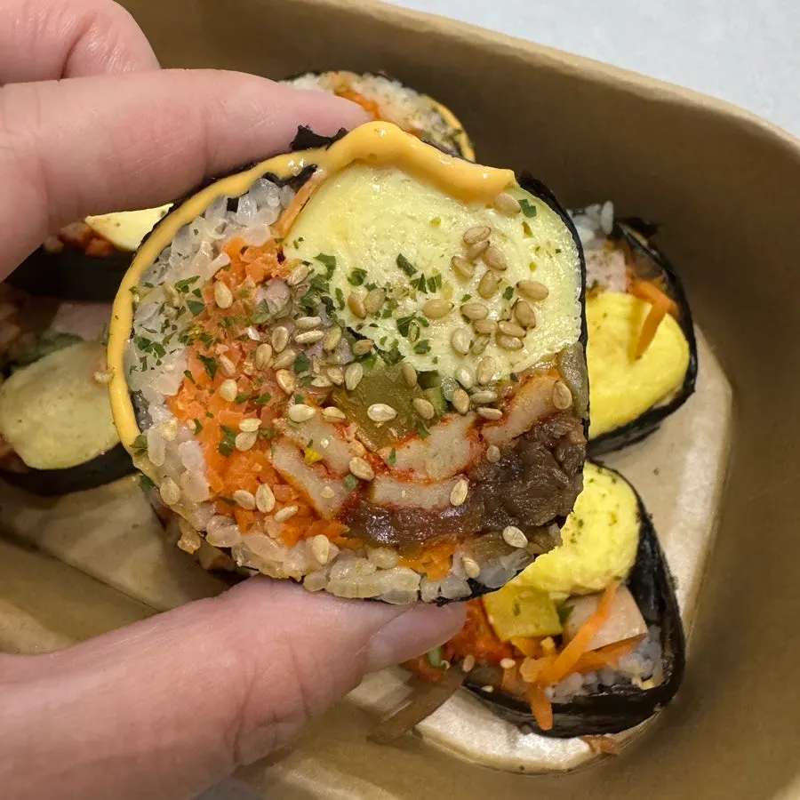 Whole egg gimbap with fish cake and vegetables wrapped in cheese