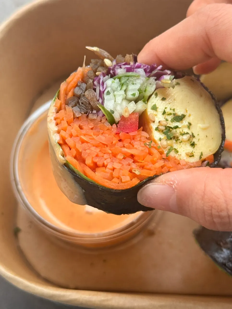 Inside of keto vegetable gimbap showing carrot, red cabbage, and rolled egg