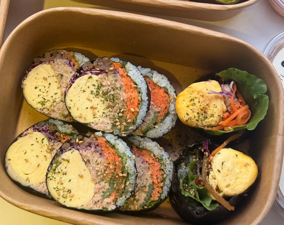 A roll of tuna-full gimbap made with rice