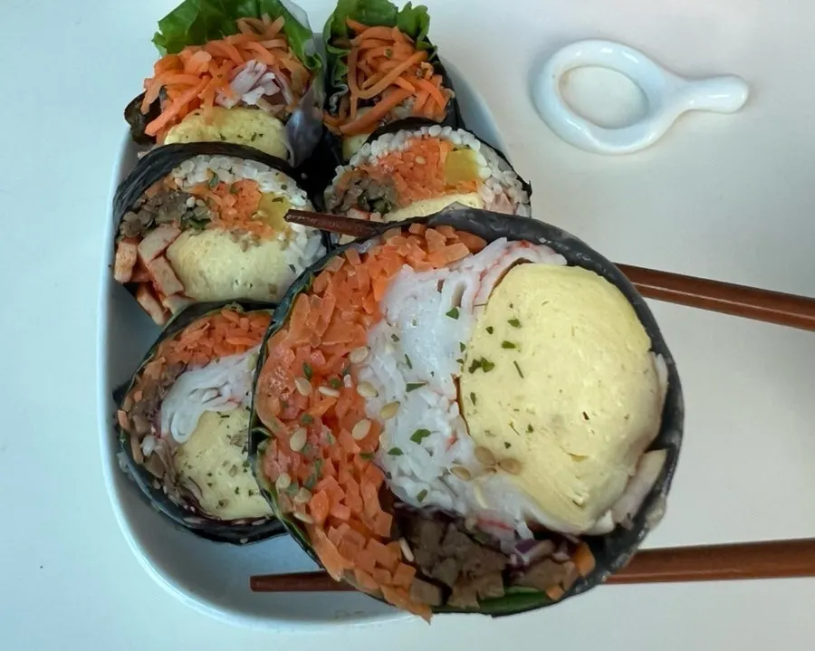 Keto crab stick gimbap and vegetable-egg gimbap eaten at home