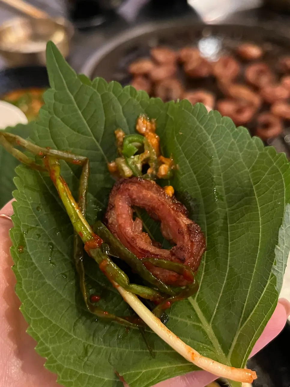 Dipping Daegu makchang in salt