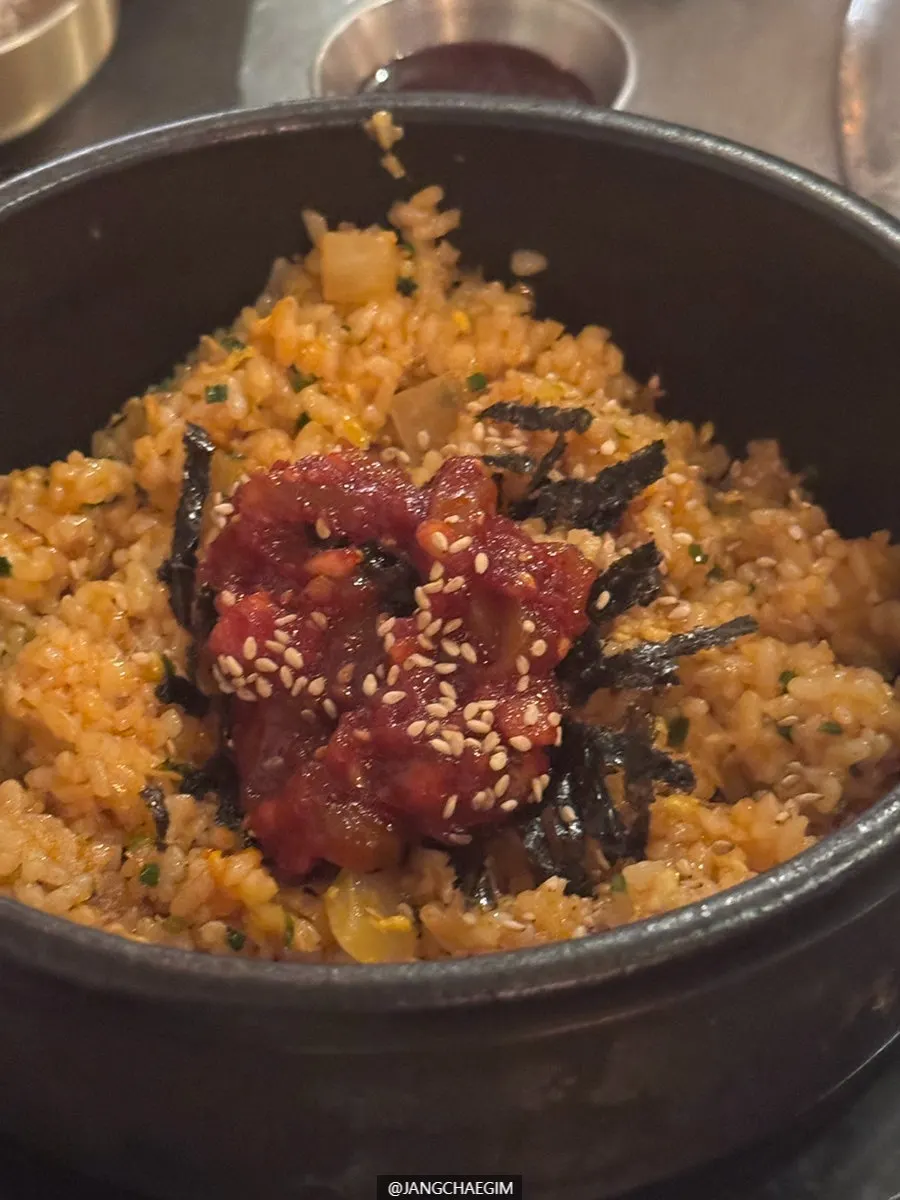 Hot pot of jeotgal fried rice topped with squid jeotgal