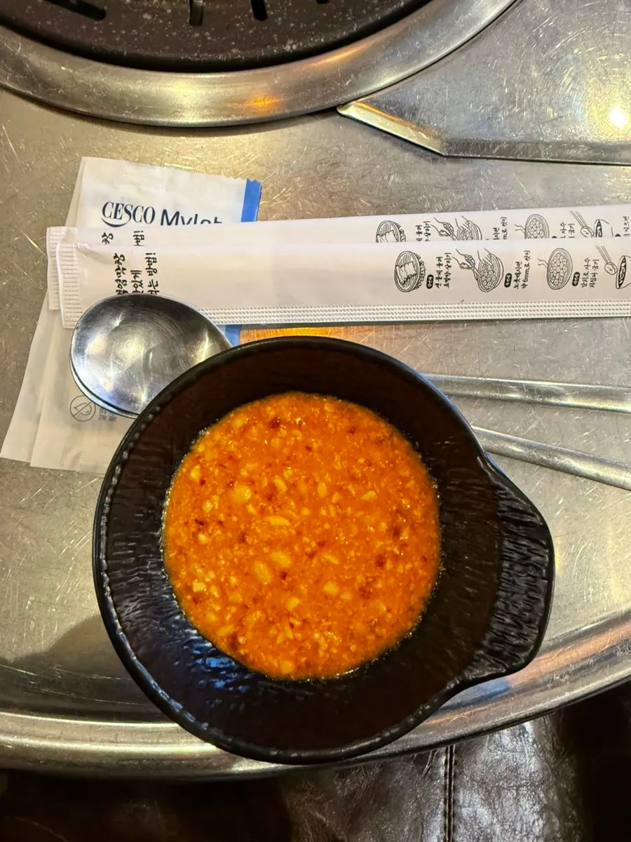 Makjang sauce, ssamjang, garlic and other side dishes on the table