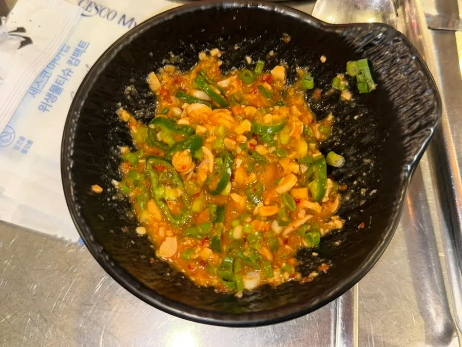 Makchang on the grill plate with complimentary soybean pulp