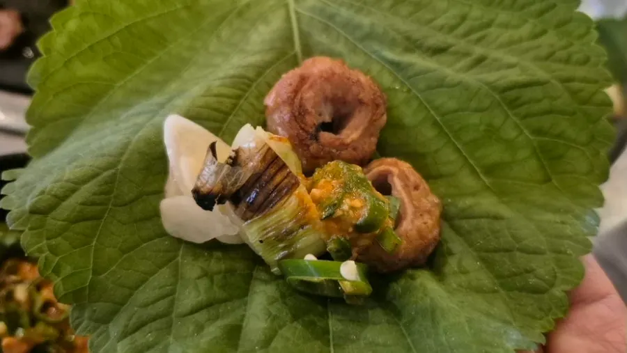 Makchang topped with ssamjang and garlic