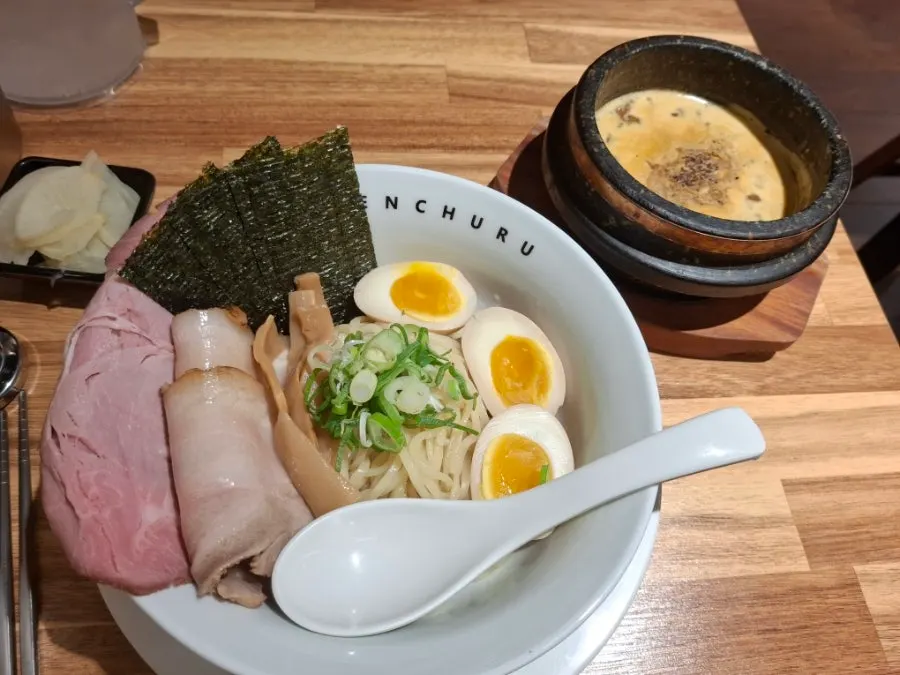 A bite of tsukemen noodles dipped in sauce