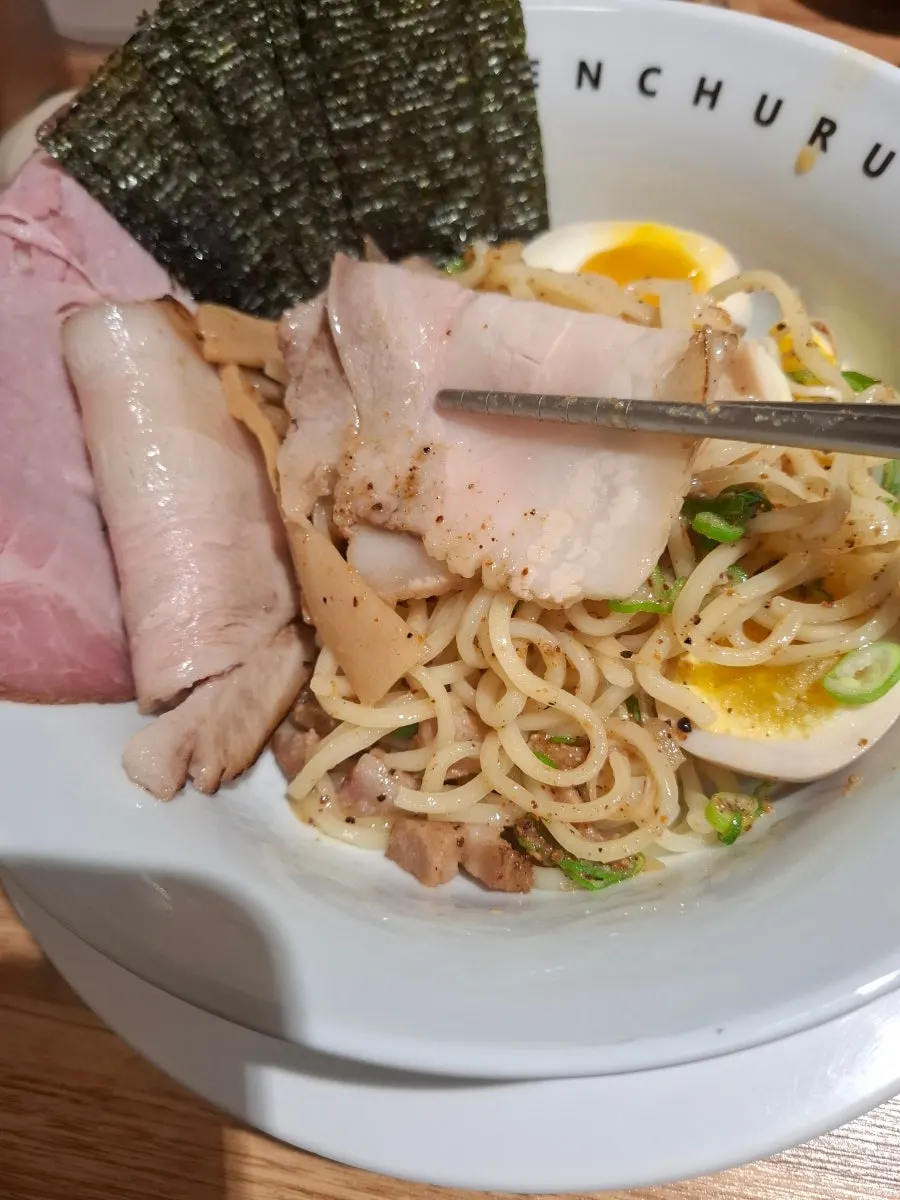 Picking up pork belly topping from the tsukemen