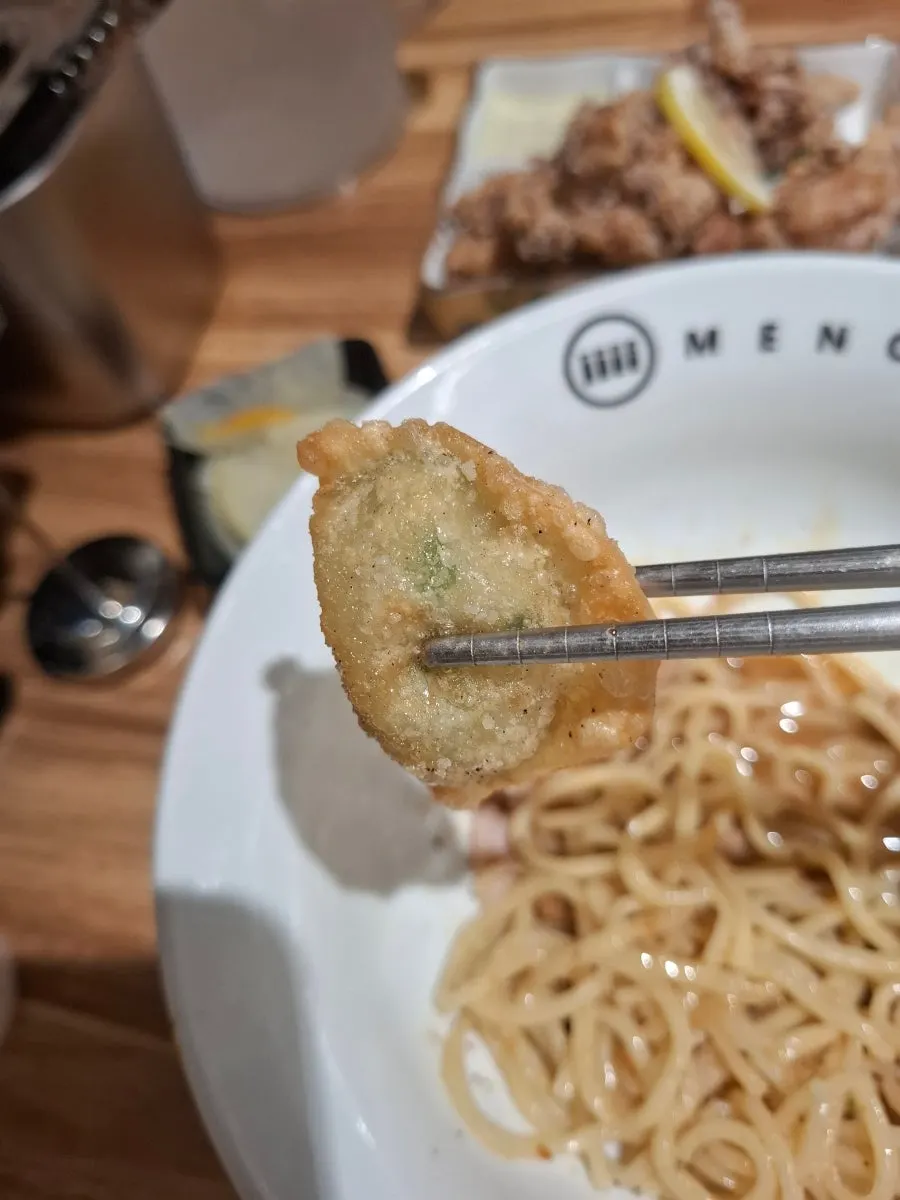 Cross-section of the fried gyoza, like a mini fried dumpling