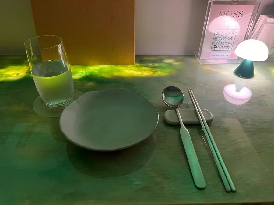 Place setting with thin water glasses and tableware