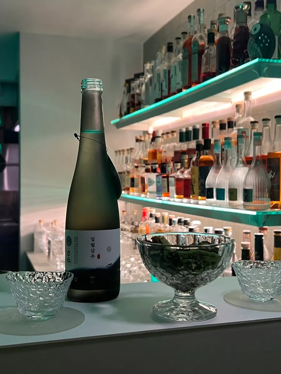 Bottle of Ilwolsamju yakju with its dedicated glass